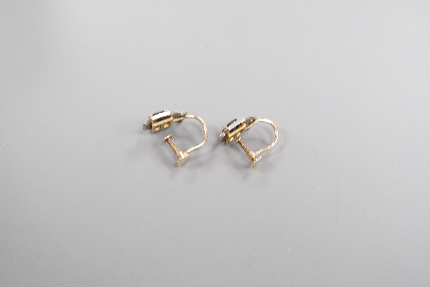 A pair of 9ct, sapphire and diamond set shaped cluster ear clips, 12mm, gross weight 2.9 grams.